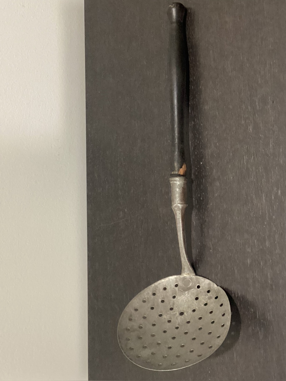 Antique Skimmer ladle essential tool in farmhouse or open-hearth kitchens.